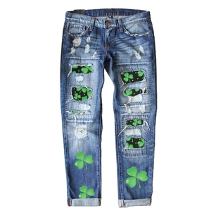 Deep blue washed straight jeans with clover prints and distressed frayed hole details