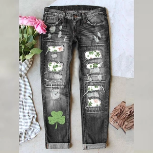 Deep grey distressed straight jeans with clover print patches and ripped details