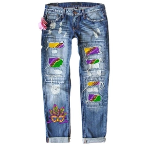 Women's blue straight jeans featuring colorful sequin distressed holes and carnival prints