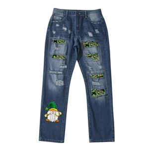 Distressed straight-leg jeans featuring St. Patrick's Day clover and leprechaun prints