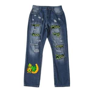 Deep blue straight-leg ripped jeans with St. Patrick's Day clover prints and holiday motif