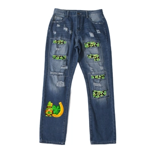 Dark blue straight leg jeans featuring clover patches and St. Patrick's Day themed print