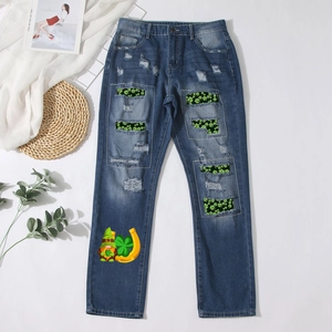 Deep blue straight denim jeans with St. Patrick's clover patches and ripped details