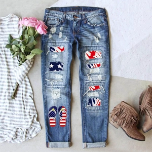 Ripped straight-leg jeans with American flag star patches and graphic prints