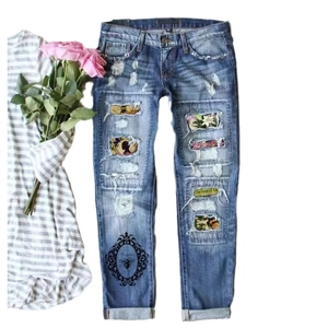 Blue distressed ripped straight jeans with floral patches and vintage bee print