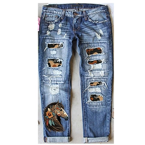 Mid-rise straight leg ripped jeans with leopard patches and colorful horse print