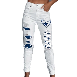 White ripped jeans for women with blue star print patterns and high waist slim fit design