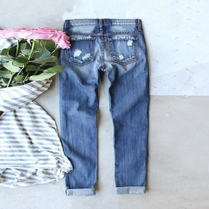 Slim fit ripped denim jeans in vintage light blue with back pocket distress details