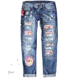 Distressed blue Christmas jeans with Santa patches and Christmas vibes print detail