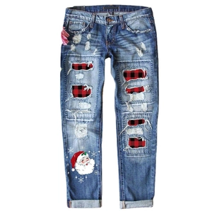 Distressed blue denim pants with red buffalo plaid patches and Santa Claus print