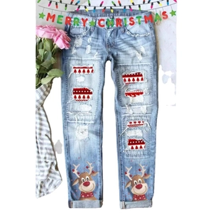Women's light blue distressed jeans with Christmas tree patches and reindeer print