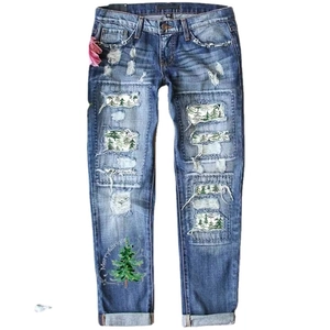 Blue distressed jeans with leopard print patches and festive Merry & Bright tree print