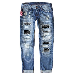 Mid-waist distressed straight denim jeans with sparkly star patches and heart print design