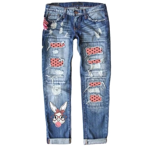 Women's straight jeans with heart print patches and bubblegum cartoon rabbit graphic