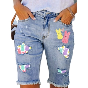 Women's light blue denim shorts with Easter Peeps bunny print and distressed ripped details
