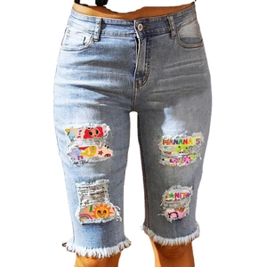 Women's high waist denim shorts with cartoon patches and distressed ripped details