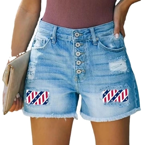 Women's light blue distressed denim shorts with high waist buttons and flag patches