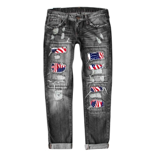 Jean noir vintage délavé avec écussons drapeau américain et détails déchirés