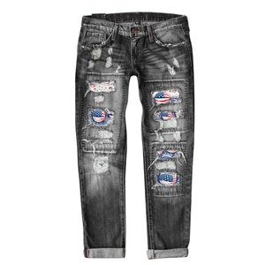 Distressed American flag patch denim jeans for women with a vintage ripped wide leg style