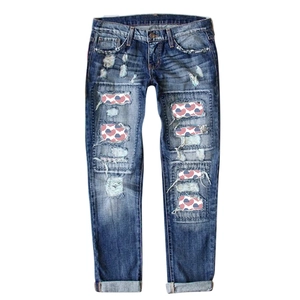 Women's dark blue ripped jeans with US flag heart patches and wide leg style