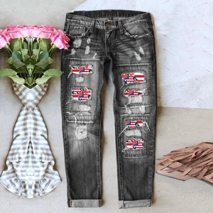 Distressed dark grey denim jeans with US flag patterned patchwork and cuffed hems