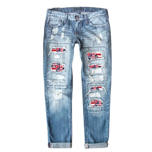 Slim fit light blue distressed jeans with US flag print patches and cuffed hems