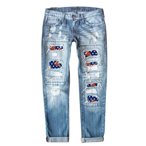 Women's light blue distressed skinny jeans with American football star pattern patches