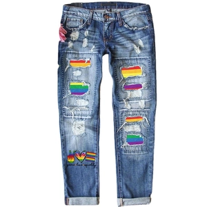 Women's mid-rise ripped jeans with rainbow sequin patches and peace love equality print