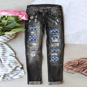 Dunkelgraue Jeans im Distressed-Look mit Sternen-Patches und modischen Rissen im Denim-Stoff