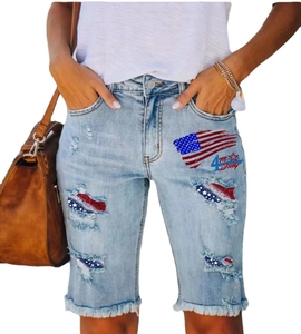 Women's 4th of July denim shorts with distressed holes and American flag pattern