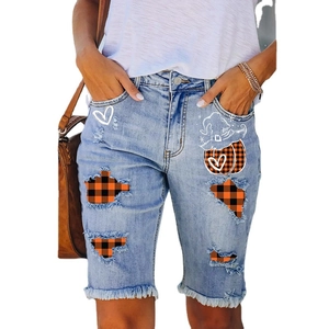 Women's light blue distressed denim Bermuda shorts with Halloween plaid patches