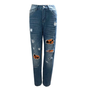 Women high waisted blue ripped jeans with orange Halloween bat print lining