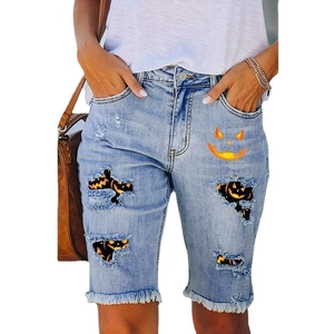 Women's light blue Halloween denim shorts with pumpkin prints and distressed frayed hems