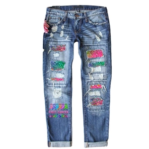 Women's blue ripped jeans with sequins and 'FIGHT CANCER in all colors' print