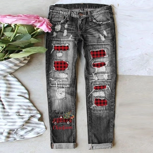 Grey distressed denim jeans with Christmas plaid patchwork and festive truck graphic