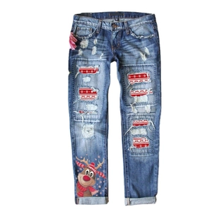 Women's mid-waist ripped jeans with Christmas reindeer motifs and snowflake fabric lining