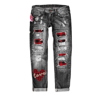 Women's grey distressed jeans with red plaid patches and heart love embroidery detail