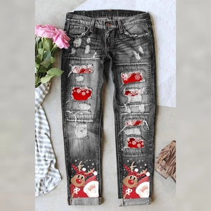 Jean noir pour femme avec détails déchirés, imprimé Père Noël et motifs flocons de neige