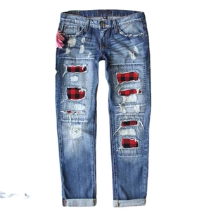 Women's blue washed distressed jeans with red plaid patches and mid-waist loose fit