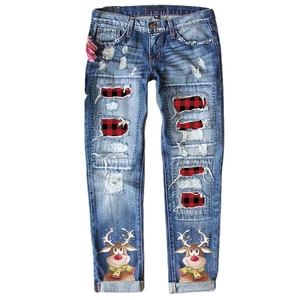 Light blue distressed denim jeans with Christmas reindeer print and red plaid patchwork
