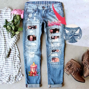 Women's light blue ripped straight jeans with love heart patches and elastic waist