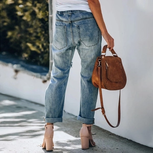 Women's light blue distressed straight jeans with elastic waist and dual back pockets
