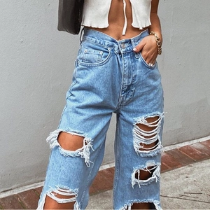 Women's high waist ripped jeans in light blue denim with distressed streetwear design