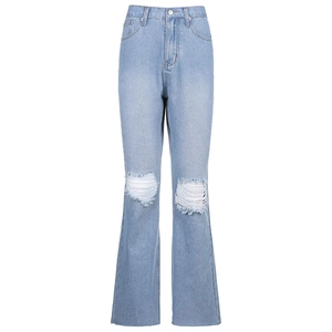 Detail of high-waisted light blue denim jeans showing distressed knee rips and frayed edges