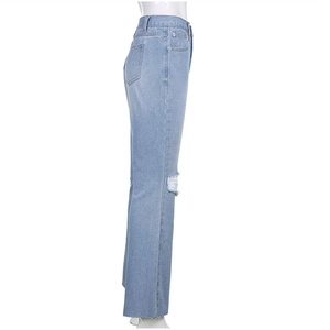 Detailed side view of high-waist light blue denim jeans with knee rips and raw hems