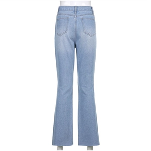 Detail view of light blue high-waisted flare jeans with back pockets and wash texture