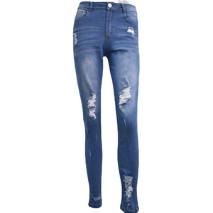 Jean skinny femme à taille haute avec déchirures et détails usés en denim bleu délavé