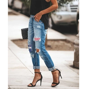 Women's vintage ripped straight jeans with American flag patches and distressed details