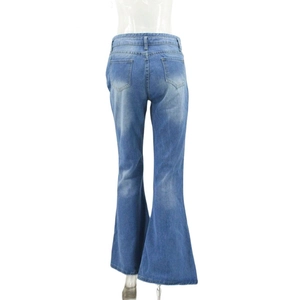 Detail showing high-waisted flared jeans with back pockets and light blue wash finish