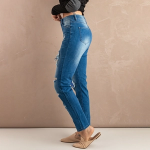 Slim fit washed blue denim jeans for women with stylish distressed ripped details
